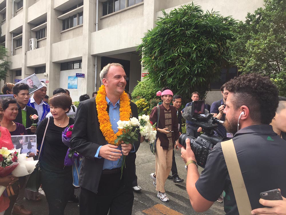 
	British migrant rights defender Andy Hall found guilty in a shock ruling by Bangkok court
